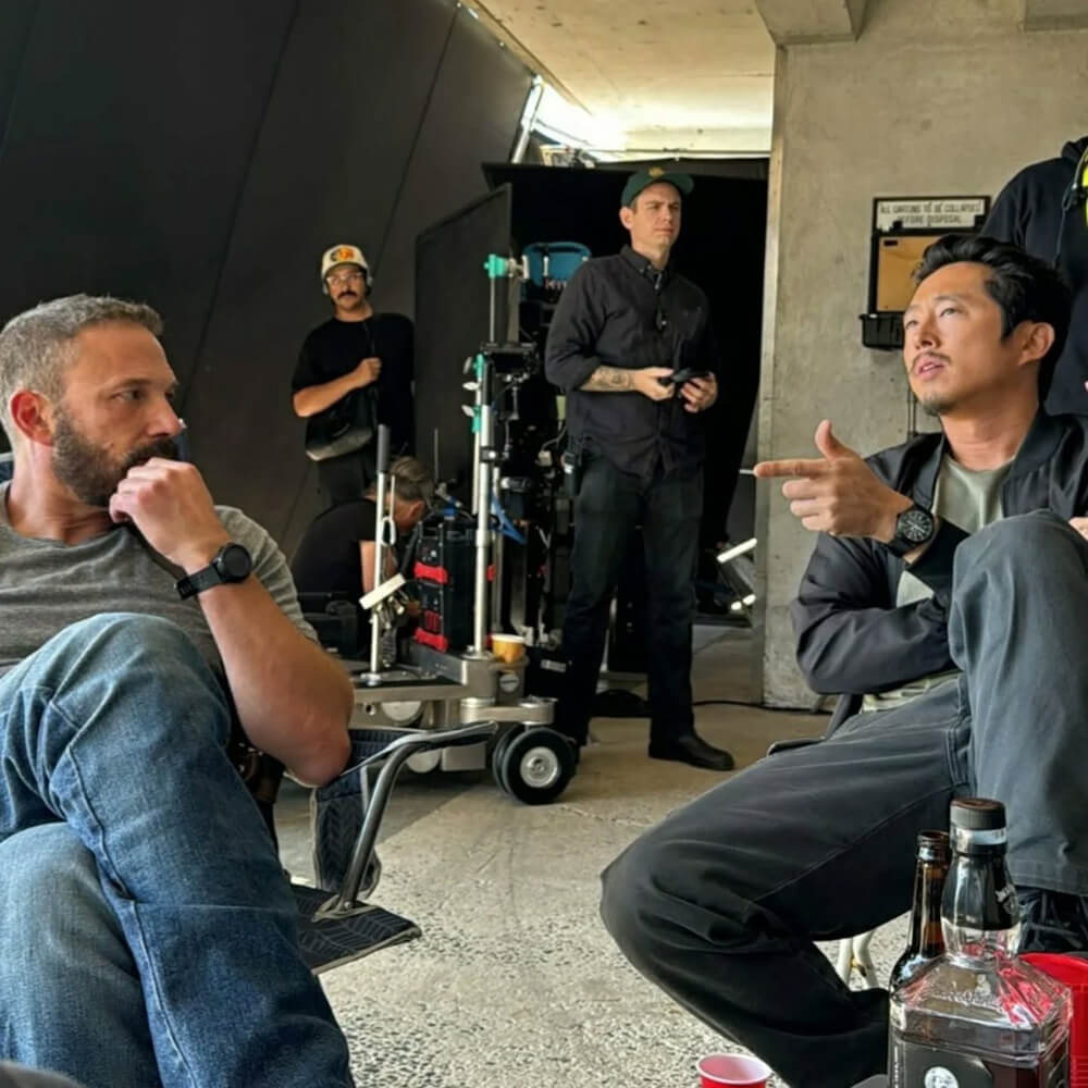 Steven Yeun and Ben Affleck on set for The Rip Netflix movie